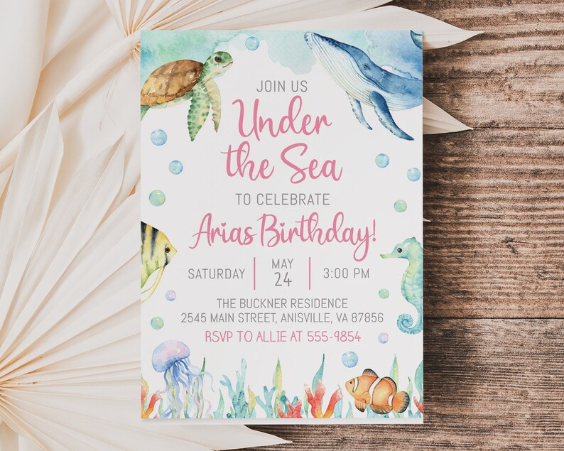 May include: Under the Sea birthday party invitation with a watercolor illustration of a whale, sea turtle, seahorse, jellyfish, and clownfish. The invitation includes the text "Join us Under the Sea to celebrate Arias Birthday!" with the date and time of the party.