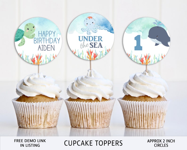 May include: Three cupcake toppers with watercolor designs featuring an octopus, a whale, and a turtle. The toppers are 2 inches in diameter and say "Happy Birthday Aiden", "Under the Sea", and "1".