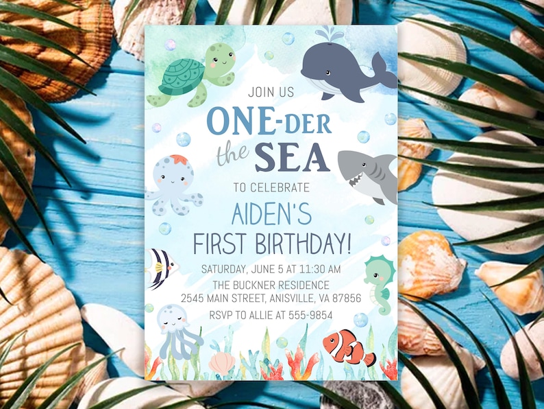 May include: A blue and white invitation with the text "ONE-DER the SEA" and "AIDEN'S FIRST BIRTHDAY!". The invitation features cartoon illustrations of sea creatures, including a turtle, whale, shark, and seahorse. The invitation is surrounded by seashells.