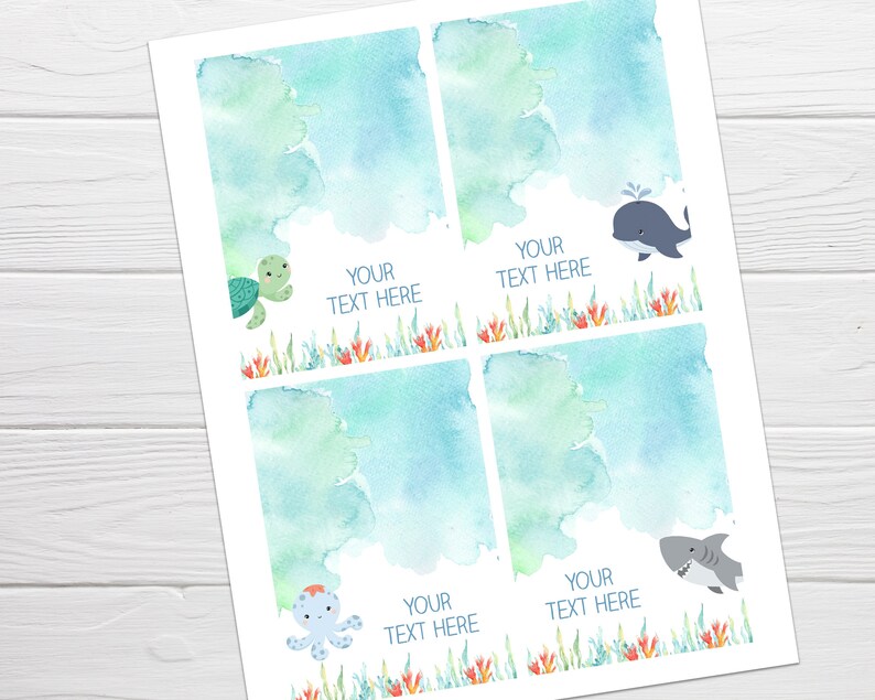 May include: Four printable gift tags featuring watercolor ocean scenes with sea creatures. Each tag has a blue and green watercolor background with a different sea creature: a turtle, a whale, an octopus, and a shark. The text "Your Text Here" appears on each tag.