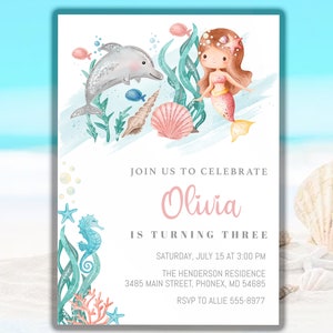 May include: A printable invitation for a child's birthday party. The invitation features a mermaid, a dolphin, and other sea creatures. The text on the invitation reads "Join us to celebrate Olivia is turning three. Saturday, July 15 at 3:00 PM. The Henderson Residence, 3485 Main Street, Phonex, MD 54685. RSVP to Allie 555-8977."