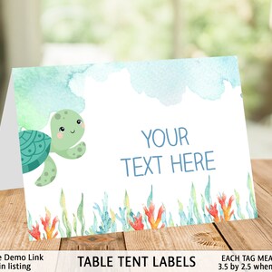 May include: A printable table tent label featuring a cartoon sea turtle with a watercolor background. The label has the text "YOUR TEXT HERE" and measures 3.5 inches by 2.5 inches when folded.