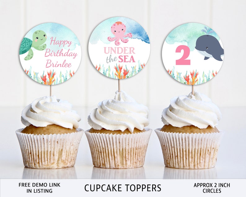 May include: Set of three 2 inch round cupcake toppers featuring an octopus, a whale, and a turtle with the text "Happy Birthday Brinlee" and "Under the Sea".