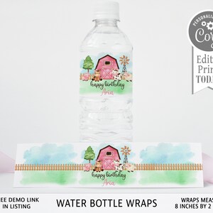 May include: Water bottle wrap with a watercolor design of a red barn, farm animals, and a fence. The wrap says "happy birthday Aria". The wrap measures 8 inches by 2 inches.