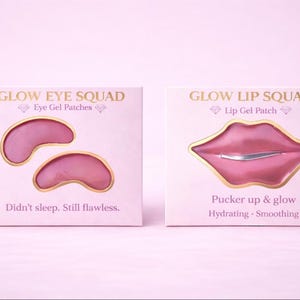 May include: Two boxes of beauty products on a pink background. One box says "GLOW EYE SQUAD" and contains two pink eye gel patches. The other box says "GLOW LIP SQUAD" and contains a pink lip gel patch. Text on the boxes reads "Didn't sleep. Still flawless." and "Pucker up & glow".