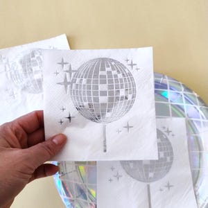 disco ball napkins
retro party decor
bride tribe party
fun party napkins
shiny party supplies
disco theme event
foil printed napkins
disco bachelorette
sparkly party table
last disco theme
party napkin set
unique party details
disco bridal bash
wedding napkins fun
70s disco party vibes