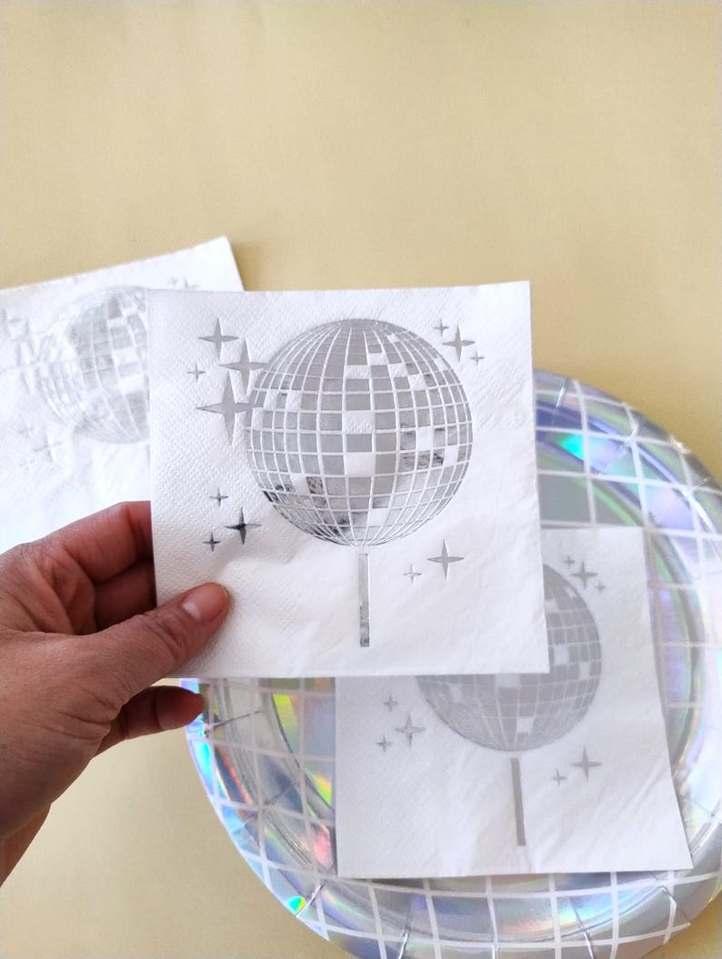 disco ball napkins
retro party decor
bride tribe party
fun party napkins
shiny party supplies
disco theme event
foil printed napkins
disco bachelorette
sparkly party table
last disco theme
party napkin set
unique party details
disco bridal bash
wedding napkins fun
70s disco party vibes