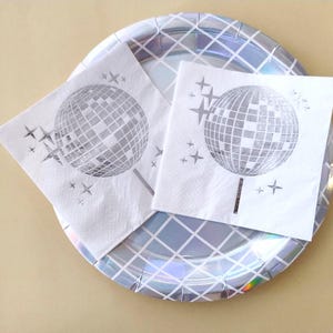 disco ball napkins
retro party decor
bride tribe party
fun party napkins
shiny party supplies
disco theme event
foil printed napkins
disco bachelorette
sparkly party table
last disco theme
party napkin set
unique party details
disco bridal bash
wedding napkins fun
70s disco party vibes