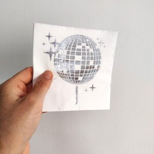 disco ball napkins
retro party decor
bride tribe party
fun party napkins
shiny party supplies
disco theme event
foil printed napkins
disco bachelorette
sparkly party table
last disco theme
party napkin set
unique party details
disco bridal bash
wedding napkins fun
70s disco party vibes