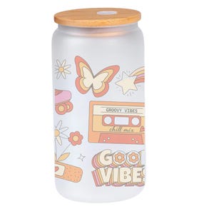 May include: A frosted glass jar with a wooden lid. The jar has a retro design with a butterfly, a cassette tape, a roller skate, and the text "Groovy Vibes" and "Good Vibes".