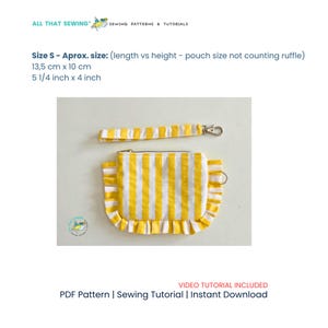 May include: A yellow and white striped fabric pouch with a ruffled edge and a matching detachable wrist strap. The pouch measures 5 1/4 inches by 4 inches. The text reads ALL THAT SEWING, Size S, and VIDEO TUTORIAL INCLUDED PDF Pattern.