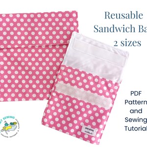 May include: Two pink and white polka dot reusable sandwich bags with velcro closures. The bags are folded open to show the white velcro. The text "Reusable Sandwich Bag 2 sizes" and "PDF Pattern and Sewing Tutorial" is printed on a white background.