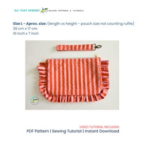 May include: A rectangular fabric pouch with vertical orange and pink stripes, featuring a ruffled edge on three sides and a matching wrist strap with a metal clasp. The pouch measures 10 inches by 7 inches, excluding the ruffle detail.
