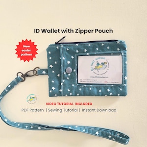 May include: Teal ID wallet with a zipper pouch, white star pattern, and a clear ID window. Includes a matching lanyard with star pattern and a metal clasp. The text "ID Wallet with Zipper Pouch" is visible.