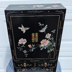 RARE Find! Beautiful Vintage Asian Storage Cabinet with Black Lacquer Finish with Illustrated Textured Designs