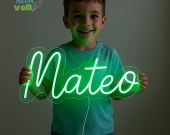 May include: A neon green sign that spells out the name "Mateo" in a cursive font. The sign is held by a person wearing a green t-shirt. The sign has a clear backing and a white power cord. The logo "Sparkle Neon Volt" is in the top left corner.