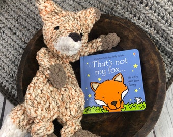 Foxie the Fox is a handmade, crocheted, knotted woodland lovey that makes for cuddly gift for a baby or toddler & can be paired with a book.