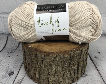 Lion Brand Touch of Linen is a worsted weight, washable, cotton blended yarn that is great for fasions.home decor & fashions.