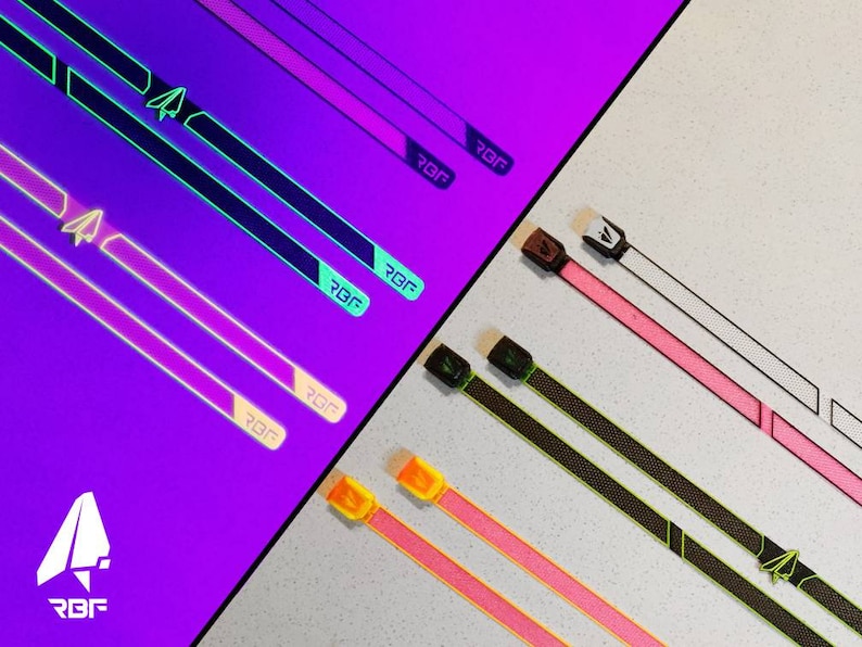K&ouml;nnte beinhalten: Eine Auswahl an farbenfrohen Riemen mit dem Text "RBF" und einem Papierflieger-Logo. Die Riemen sind in verschiedenen Farben erh&auml;ltlich, darunter Pink, Schwarz und Wei&szlig;, mit neon-gr&uuml;nen und lila Akzenten. Die Riemen werden auf einem lila und wei&szlig;en Hintergrund pr&auml;sentiert.