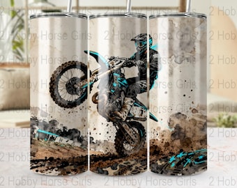 May include: A stainless steel tumbler featuring a watercolor illustration of a motocross rider on a dirt bike. The design includes splashes of brown, black, and teal, with the text "2 Hobby Horse Girls" repeated.