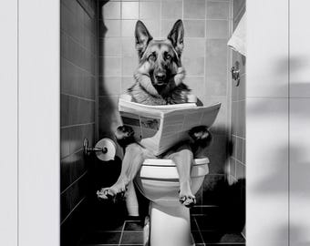 May include: A black and white wall art print featuring a German Shepherd dog sitting on a white toilet in a tiled bathroom. The dog is holding an open newspaper with both front paws, looking forward with an alert expression in a humorous scene.