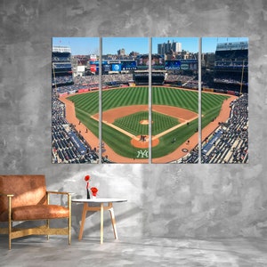 May include: A panoramic view of a baseball field from the stands, showing the green field, the dirt infield, and the stands filled with fans. The image is divided into three sections, with the text "CASIO" visible in the center section.