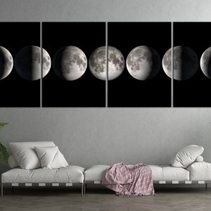 May include: A black and white canvas print of the moon in eight different phases. The moon is depicted in a circular shape with a dark background.