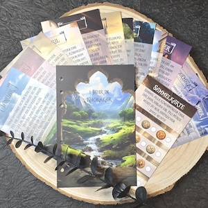 May include: A collection of cards with colorful illustrations and text in German. The cards feature a variety of themes, including a year in Khorakar, a collection of coins, and a calendar. The cards are arranged on a wooden surface.
