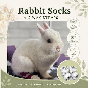 May include: A white rabbit wearing maroon socks with 2 way straps. The image includes text: Rabbit Socks, 2 WAY STRAPS, PROTECTS PAWS, SOFT & COMFORTABLE, GENTLE FIT, SUPPORT, PROTECT, COMFORT, and a line drawing of the socks with fuzzy lining.