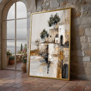 Può includere: Dipinto di paesaggio astratto in una cornice dorata. L'opera raffigura una scena costiera con edifici, alberi e una tavolozza di colori tenui di beige, marrone e nero. Il dipinto è appoggiato a un muro di pietra.