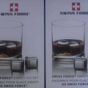 May include: Two images of a glass of whiskey with ice cubes. The glass is on a white background with the text "SWISS FORCE® ENVOY ICE SET ENSEMBLE POUR GLACE ENVOY DE SWISS FORCE®" below the glass.