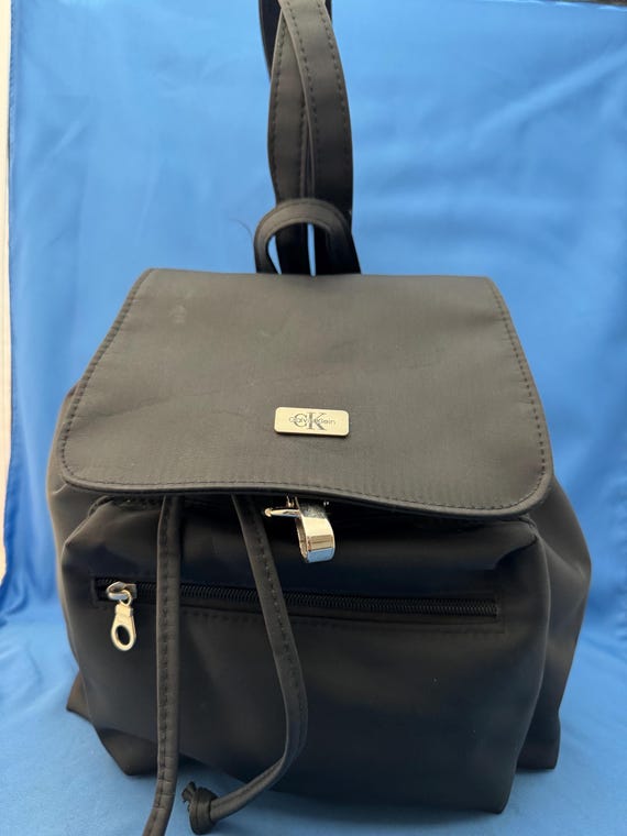 calvin klein drawstring leather backpack Women's Myra for Women Vegan Convertible Sling Backpack, 2 Pockets, Black/Silver, One Size: Clothing, Shoes & Jewelry and adjustable shoulder straps.Composition Calvin Klein Raised Round Backpack