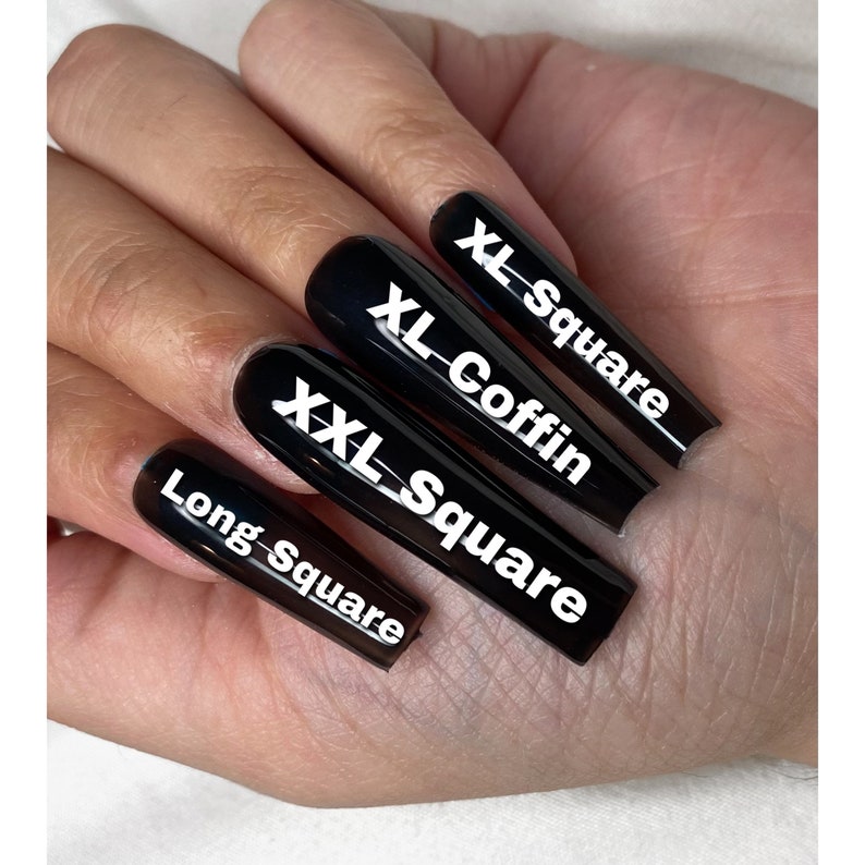 May include: Four black long nails with white text. The nails are labeled "Long Square", "XXL Square", "XL Coffin", and "XL Square".