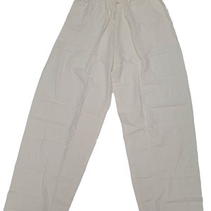 May include: A pair of off-white, lightweight trousers with a drawstring waist.