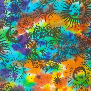 May include: A colorful tie-dye fabric with a psychedelic pattern of suns, moons, and stars. The fabric is a blend of blue, green, orange, yellow, and purple.