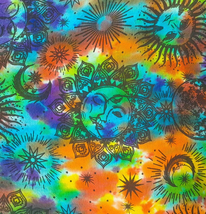 May include: A colorful tie-dye fabric with a psychedelic pattern of suns, moons, and stars. The fabric is a blend of blue, green, orange, yellow, and purple.