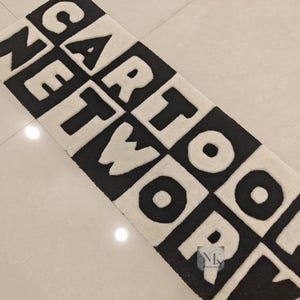 Handmade Cartoon Network Inspired rug-Retro style mat for home decor-Unique Black and Cartoon Logo design-Perfect for Kids rooms, Playrooms.