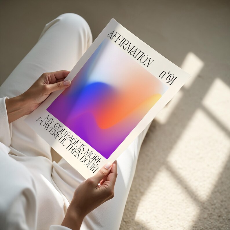 a person sitting on the floor holding a book