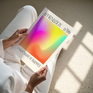 a person sitting on the floor holding a book