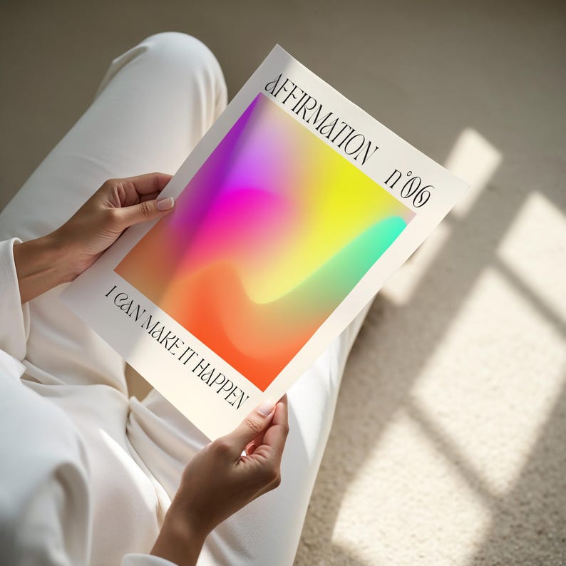 a person sitting on the floor holding a book