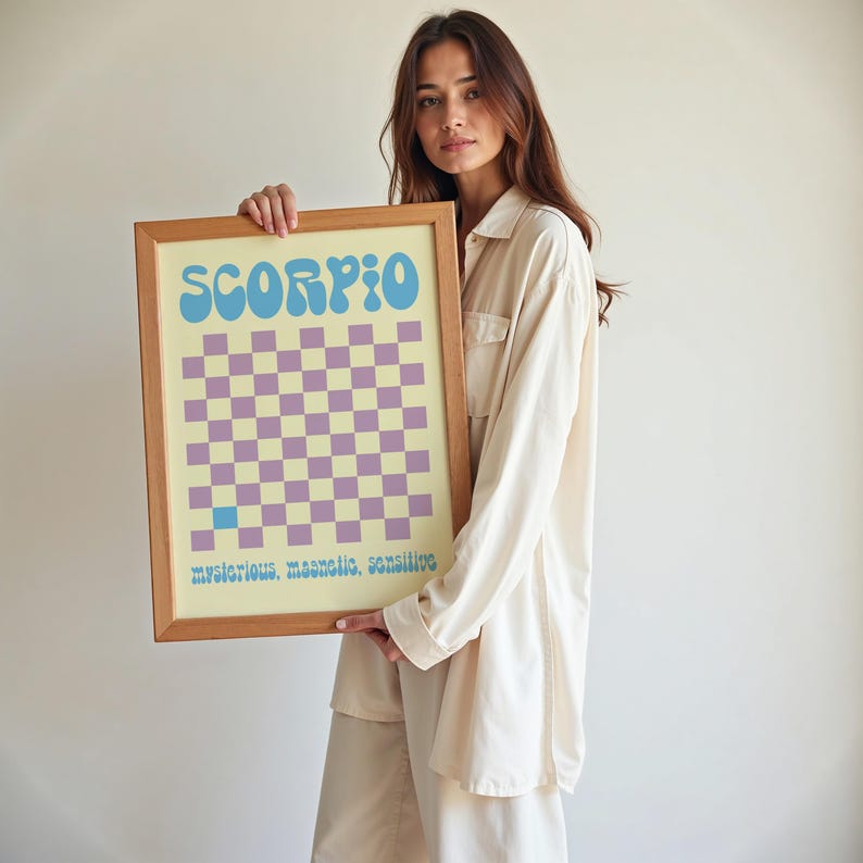 a woman holding up a framed game board