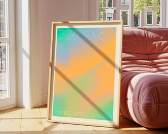 May include: A framed art print with a colorful abstract design. The word "PISCES" is at the top in white, with "INTUITIVE ARTISTIC GRACIOUS" at the bottom. The artwork features a blend of orange, green, and blue hues.