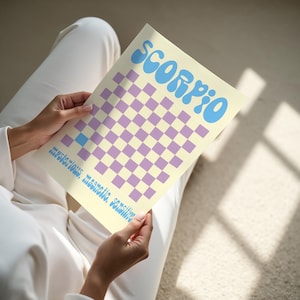 a person sitting on the floor reading a book