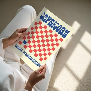 a person sitting on the floor reading a book