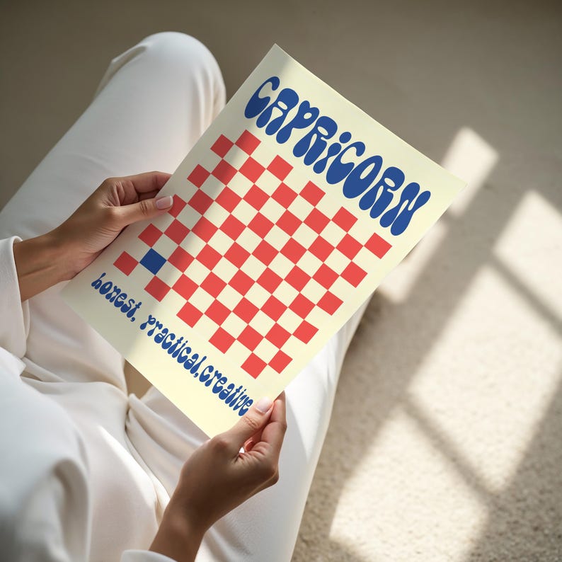 a person sitting on the floor reading a book