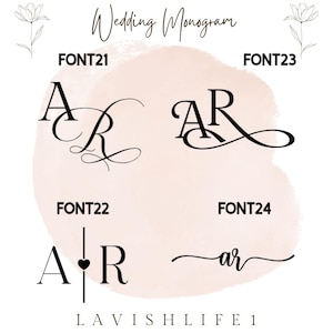 May include: A digital display showing four black wedding monogram font options labeled FONT21, FONT22, FONT23, and FONT24. The designs feature the letters A and R in various calligraphic and serif styles, set against a soft pink watercolor background.