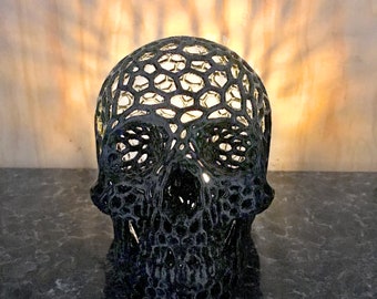 Detailed lattice skull with LED flame effect candle