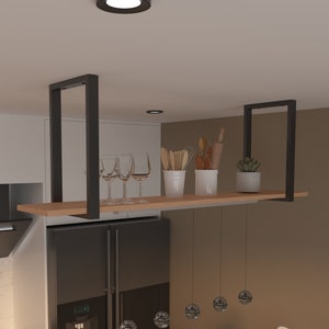 May include: A black metal shelf with wooden shelves hangs from the ceiling above a black refrigerator. The shelf is decorated with glasses, utensils, and plants. There are also decorative hanging light fixtures.