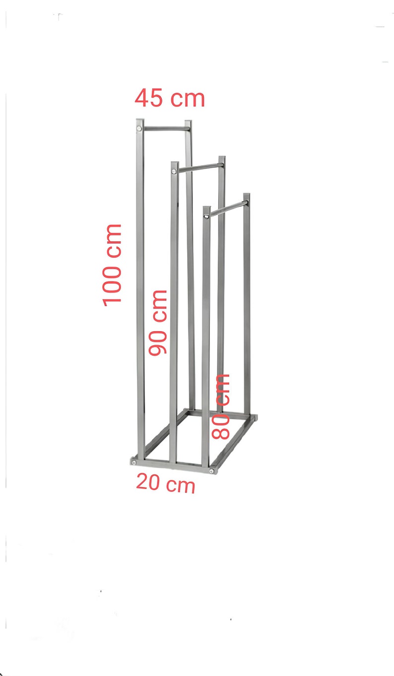 May include: A silver metal clothing rack with three bars. The rack is 45 cm wide, 100 cm tall, 90 cm deep, and 80 cm wide. The rack has a 20 cm wide base.
