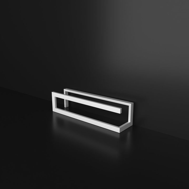 May include: A white metal shelf unit with two rectangular shelves. The shelves are open on all sides and are designed to hold items like books or decorative objects.